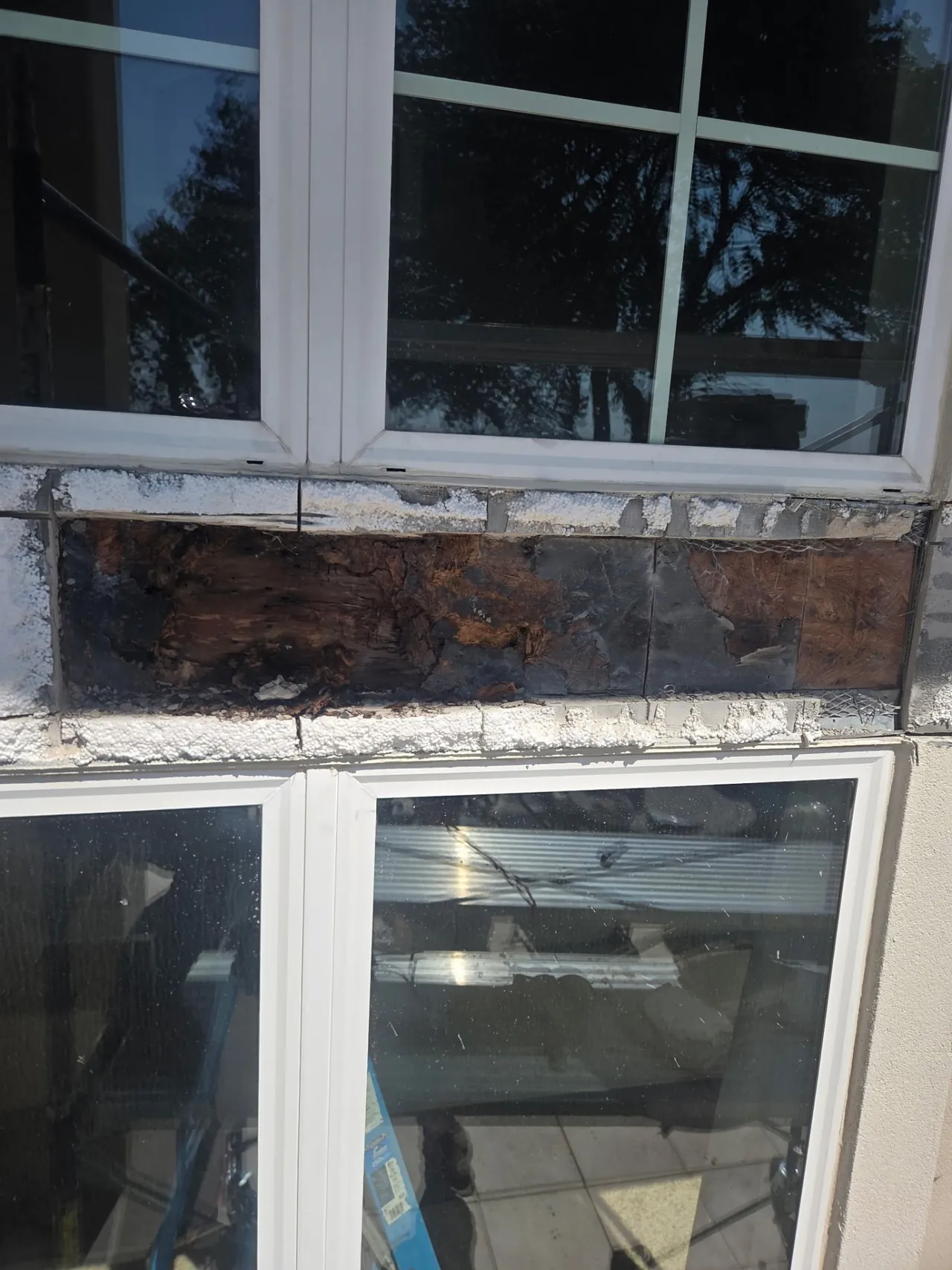 Rotted Sheathing Between Windows — Before — Grand Lake, OK
