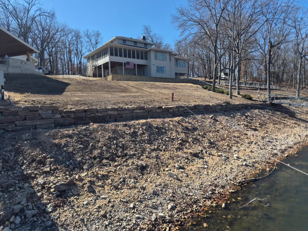 Lakefront Sod & Grading — Regraded slope ready for sod.