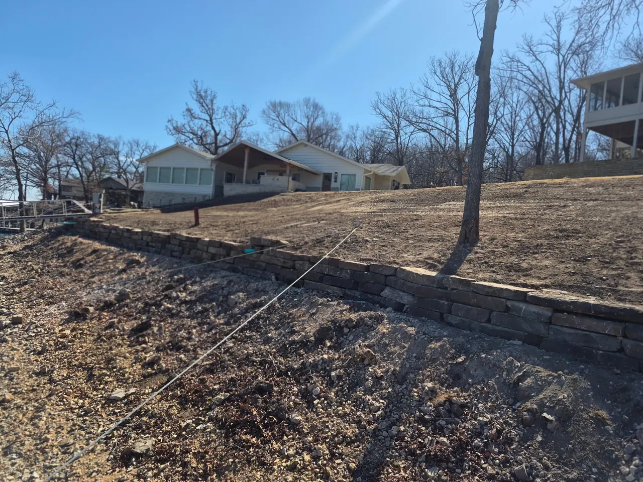 Lakefront Sod & Grading — Smooth dirt work at the shoreline.