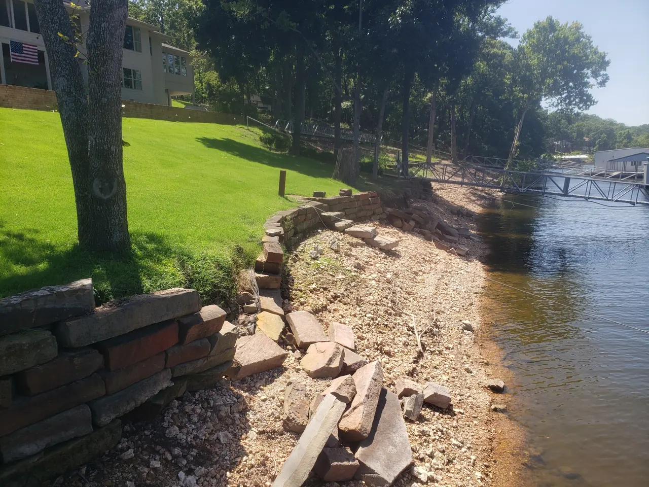 Grand Lake Seawall Rebuild — Erosion had undermined the shoreline grade.