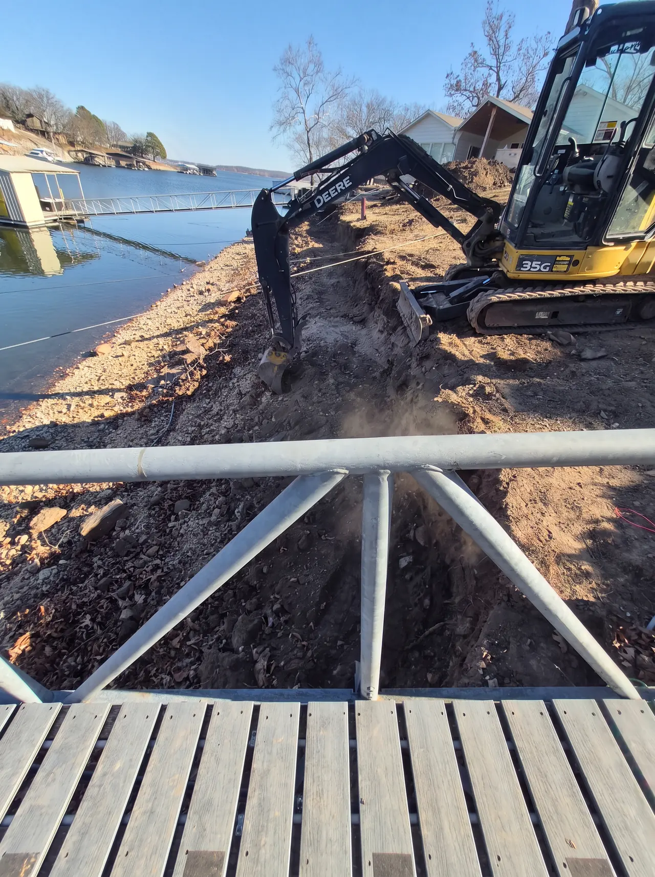 Grand Lake Seawall Rebuild — Excavation along the shoreline to prepare the footing.