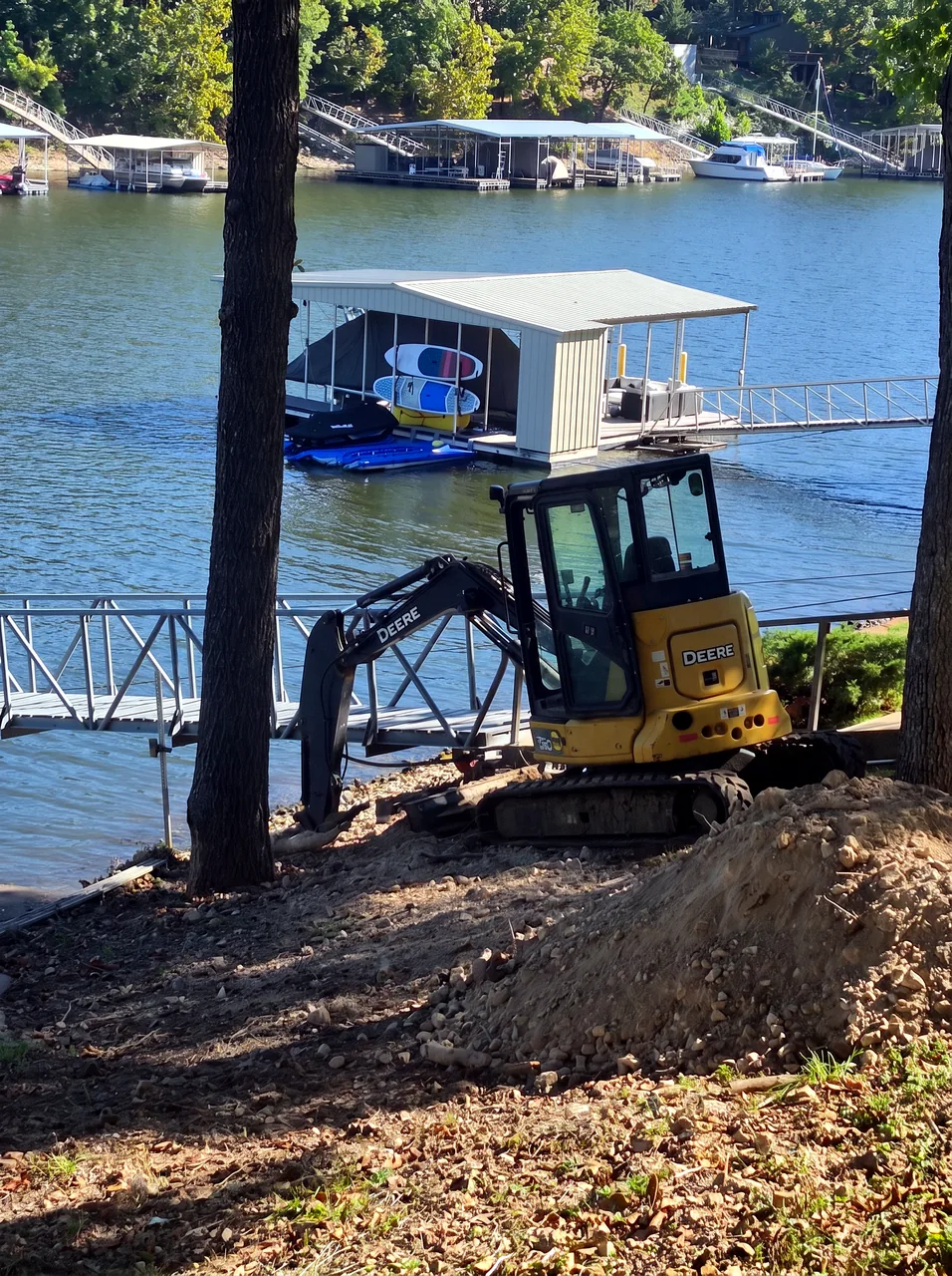 Mini Excavator Reshaping the Shoreline Grade — In Progress — Grand Lake, OK