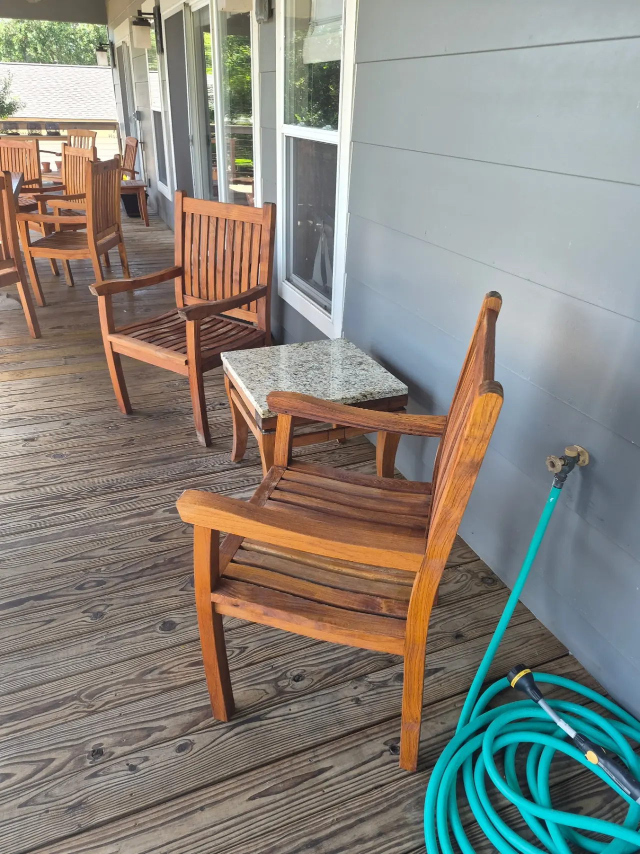 Lakefront Teak Furniture Refinishing — Teak chairs restored to deep golden brown.