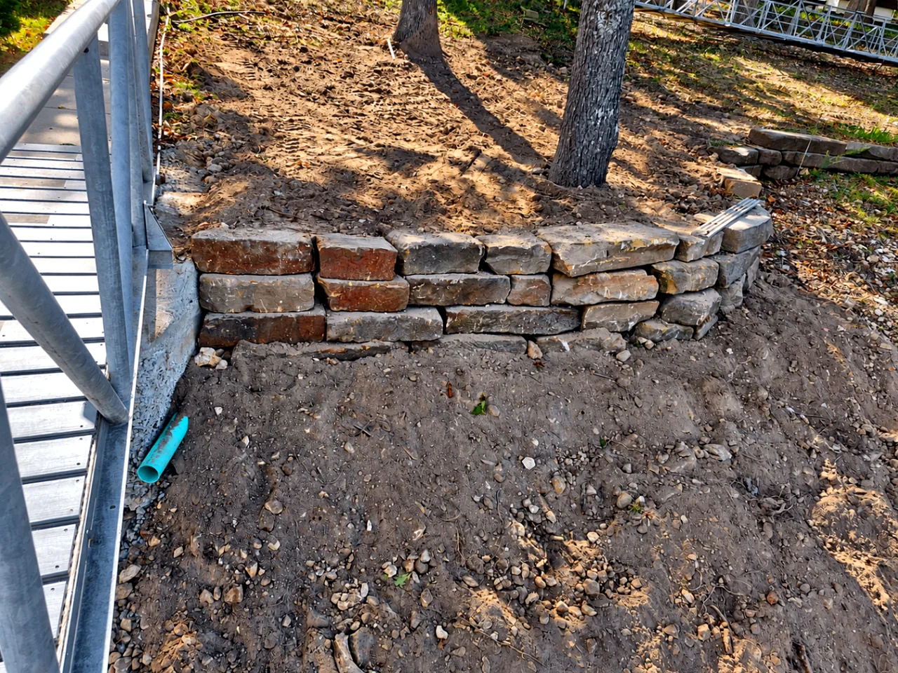 New Boulder Retaining Wall by the Deck — After — Grand Lake, OK
