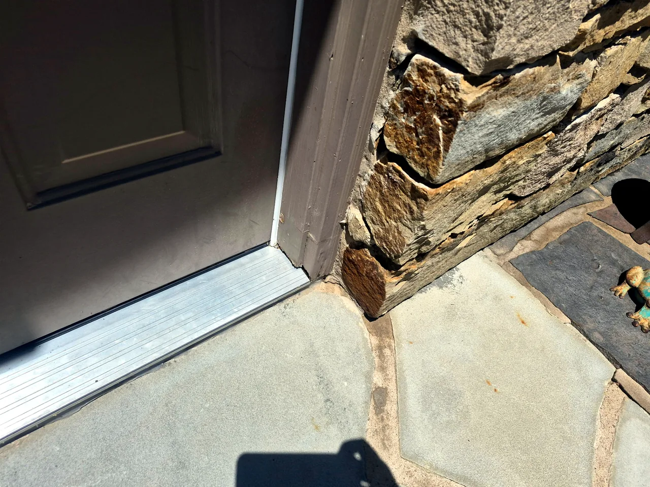 Door Jamb at Stone Walkway — Before — Grand Lake, OK