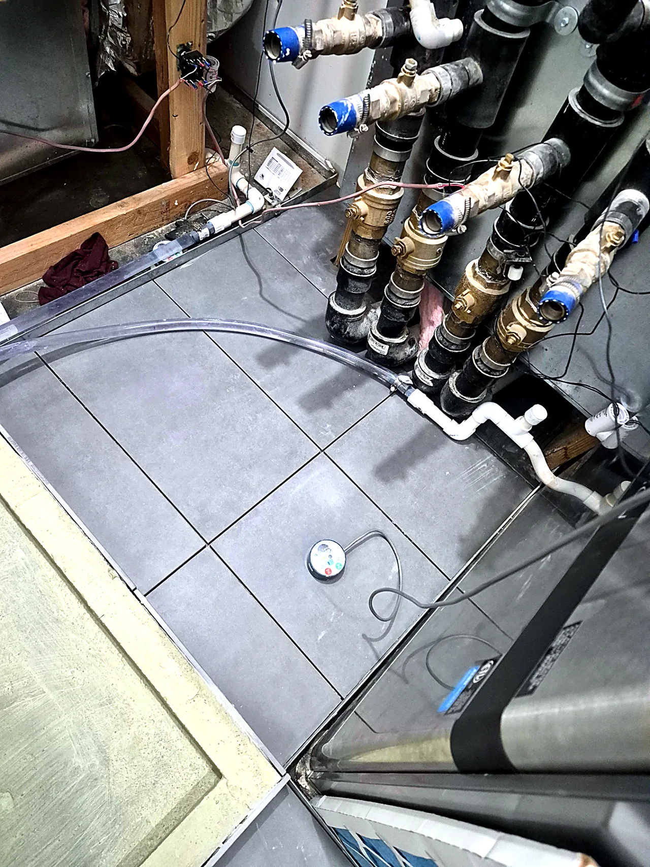 Tile Fit Around Manifold Piping — In Progress — Grand Lake, OK