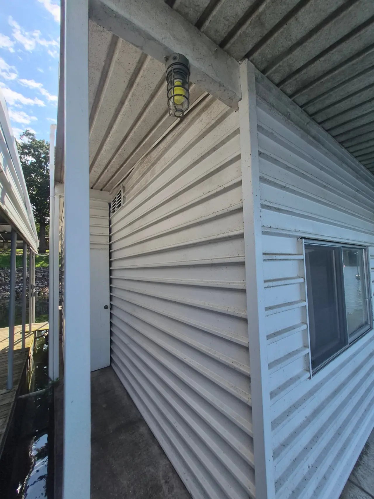 Boathouse Siding — Before — Grand Lake, OK